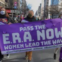 Ben Von Klemperer/Shutterstock Demonstrators march at a Manhattan rally in support of the Equal Rights Amendment, March 2021.